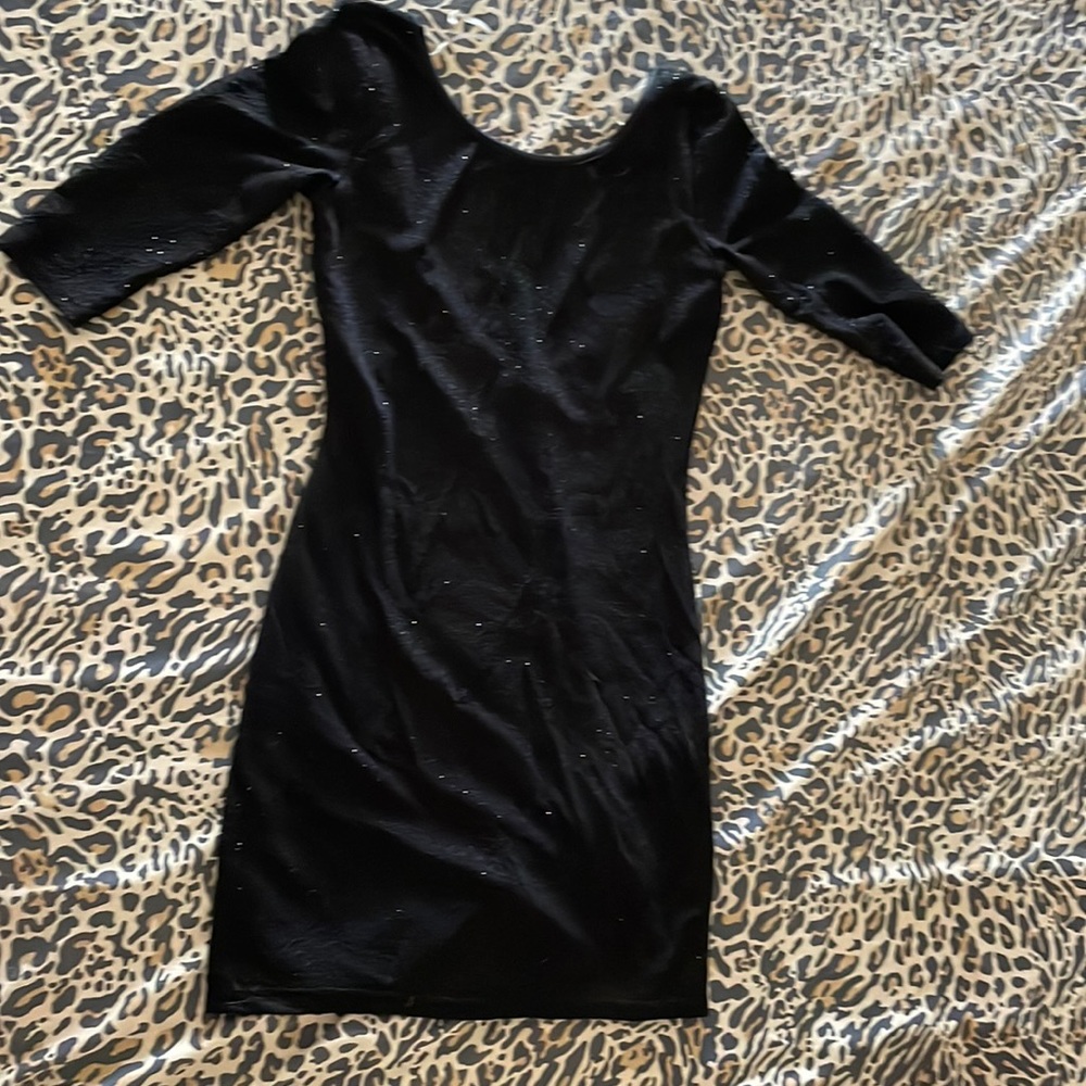 Lovely day black sparkly mini dress with scoop neck in back. 3/4 length sleeve